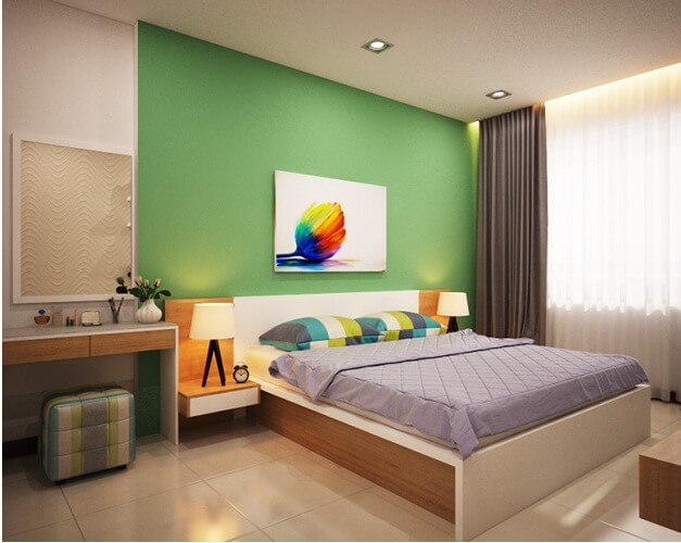 Phòng ngủ chính cũng được tận dụng mầu xanh làm điểm nhấn