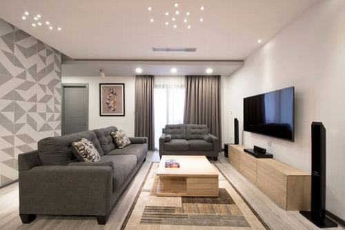 Phòng khách được thiết kế cải tạo căn hộ sang trọng với gam màu trầm Phòng khách được thiết kế cải tạo căn hộ sang trọng với gam màu trầm