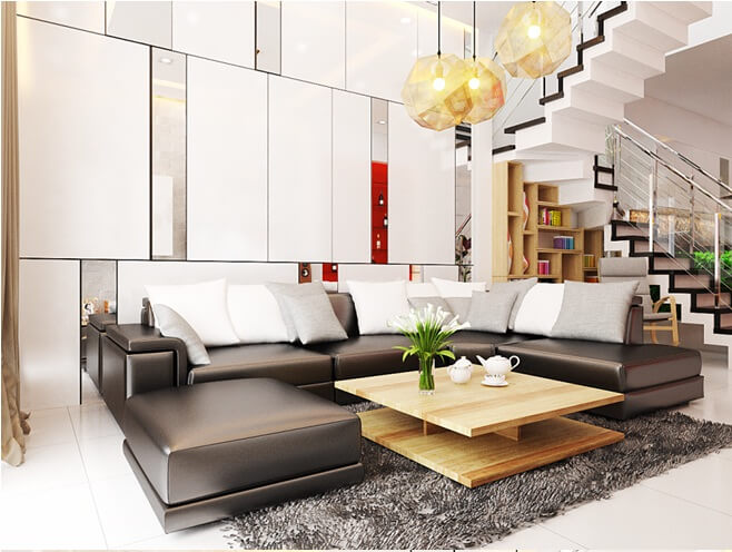 Phòng khách thiết kế đơn giản, nội thất hiện đại với những khối cạnh sắc nét và đèn chùm độc đáo làm điểm nhấn đầy ấn tượng trong mẫu nhà đẹp này.