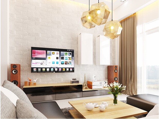 Phòng khách thiết kế đơn giản, nội thất hiện đại với những khối cạnh sắc nét và đèn chùm độc đáo làm điểm nhấn đầy ấn tượng trong mẫu nhà đẹp này.