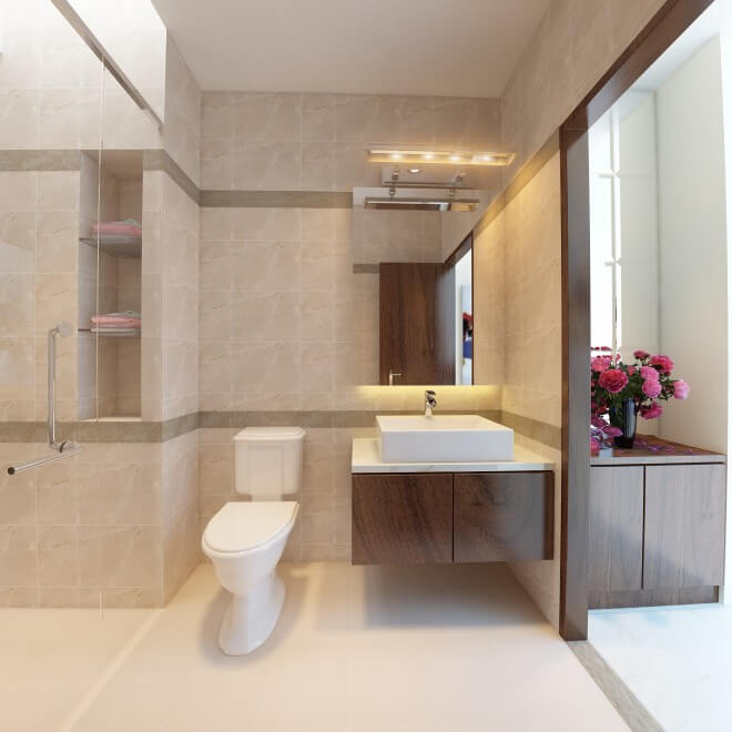 Phòng tắm rộng rãi dưới tầng một dùng chất liệu gạch giả đá màu sắc đơn giản ấn tượng trong mẫu thiết kế biệt thự.