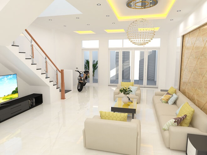 Phòng khách trong mẫu thiết kế nhà ống ở gần cửa hướng ra sân trước nên đón được nhiều gió và ánh sáng. Tivi được đặt dưới gầm cầu thang để tiết kiệm diện tích
