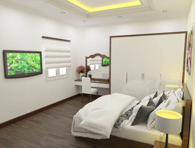 Phòng ngủ chính nhà ống thiết kế đặt dưới tầng 1 luôn có ánh sáng tự nhiên nhờ khung cửa sổ mở ra sân sau