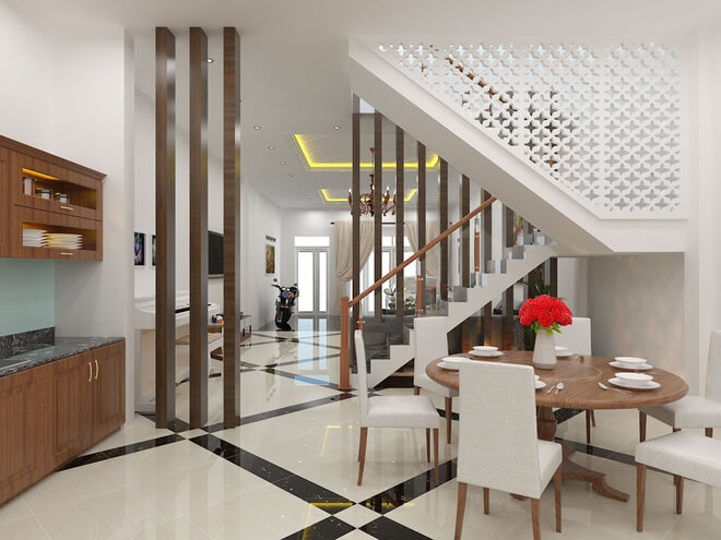 Hệ lam gỗ ngăn cách các không gian với nhau thay cho những vách tường dày, bếp thoáng rộng trong mẫu thiết kế nhà phố ba tầng.