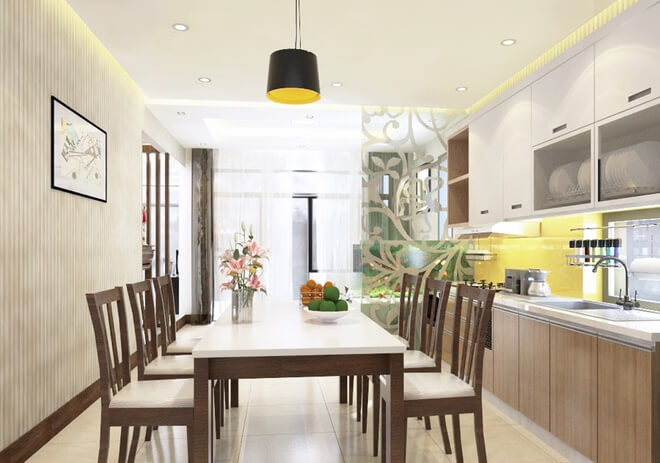 Không gian bếp nằm ở trung tâm với tông màu trung tính, ấm áp, nội thất hiện đại trong mẫu thiết kế nhà một tầng này.