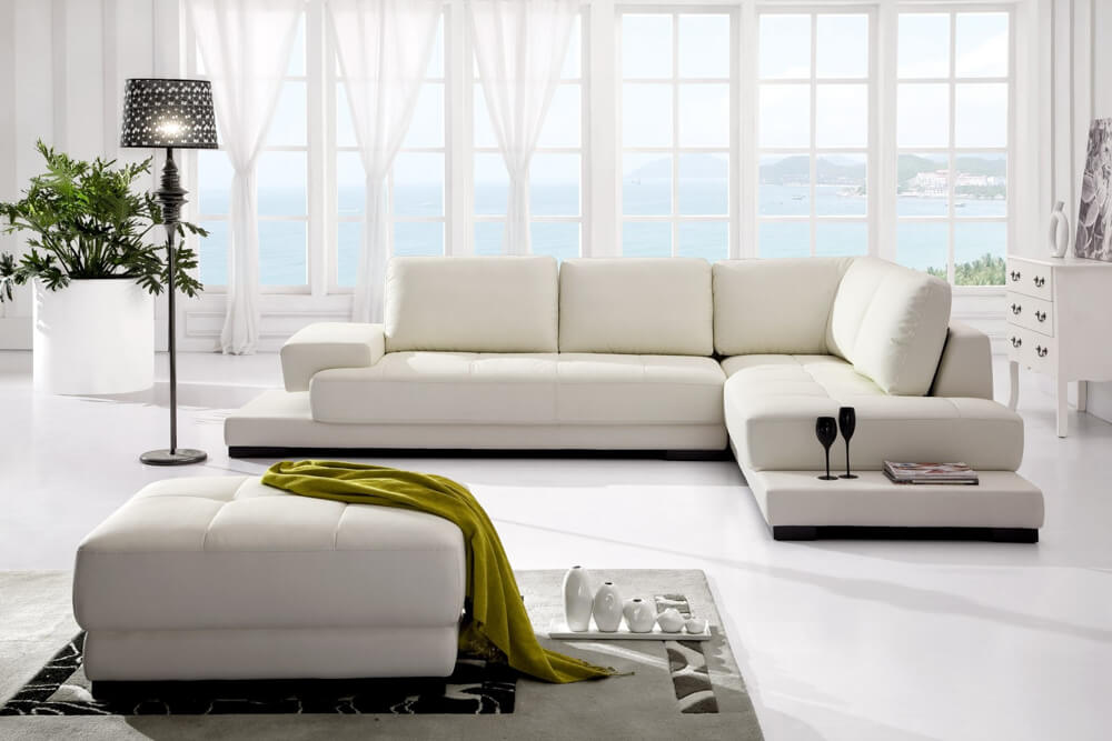 Thiết kế nhà 3 tầng, với phòng khách sử dụng bộ ghế sofa hiện đại, màu sắc trang nhã.